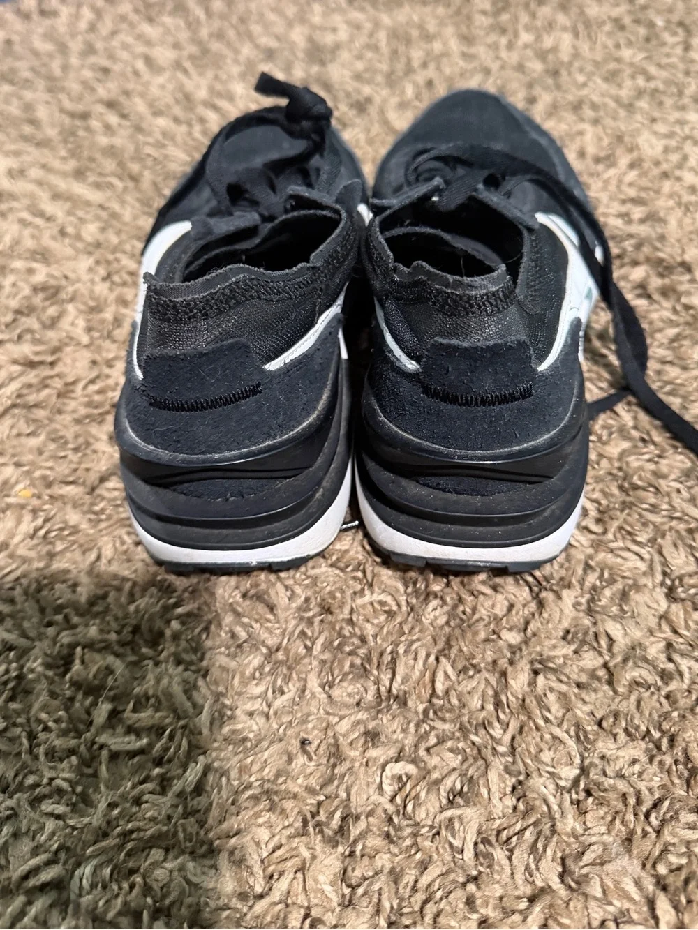 Nike Men’s Black Sneakers with White Swoosh